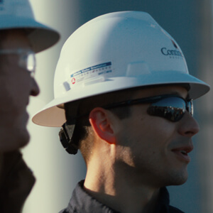 Worker in a hard hat and sunglasses